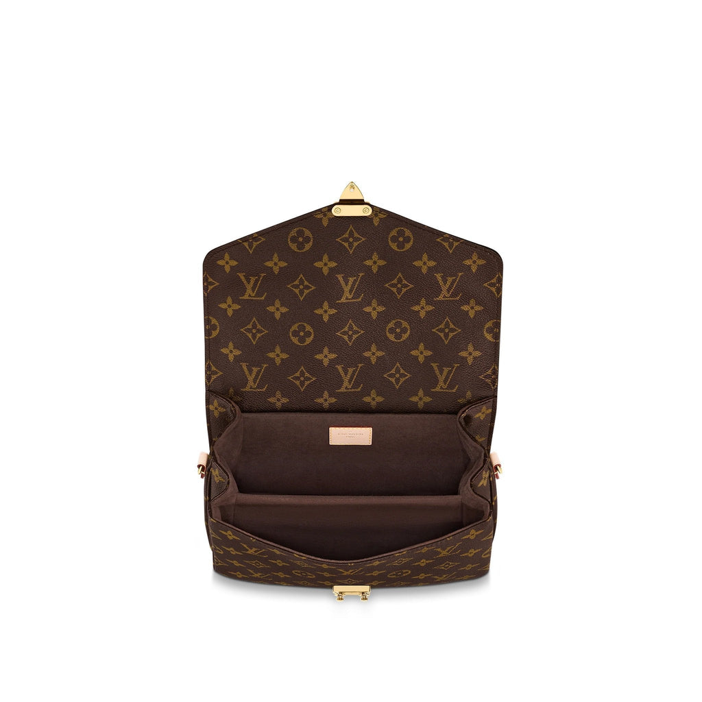 The bag worn over the shoulder with its long detachable strap