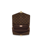 The bag worn over the shoulder with its long detachable strap