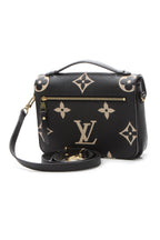 A side profile of the bag with its strap attached