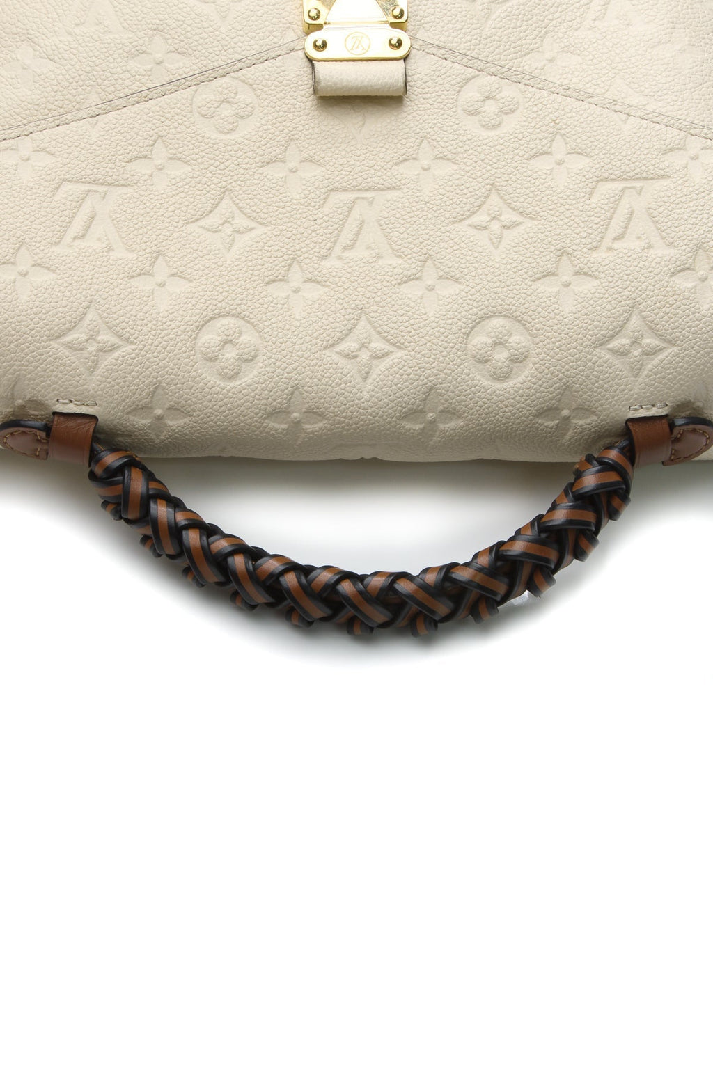 The bag shown with its braided top handle.