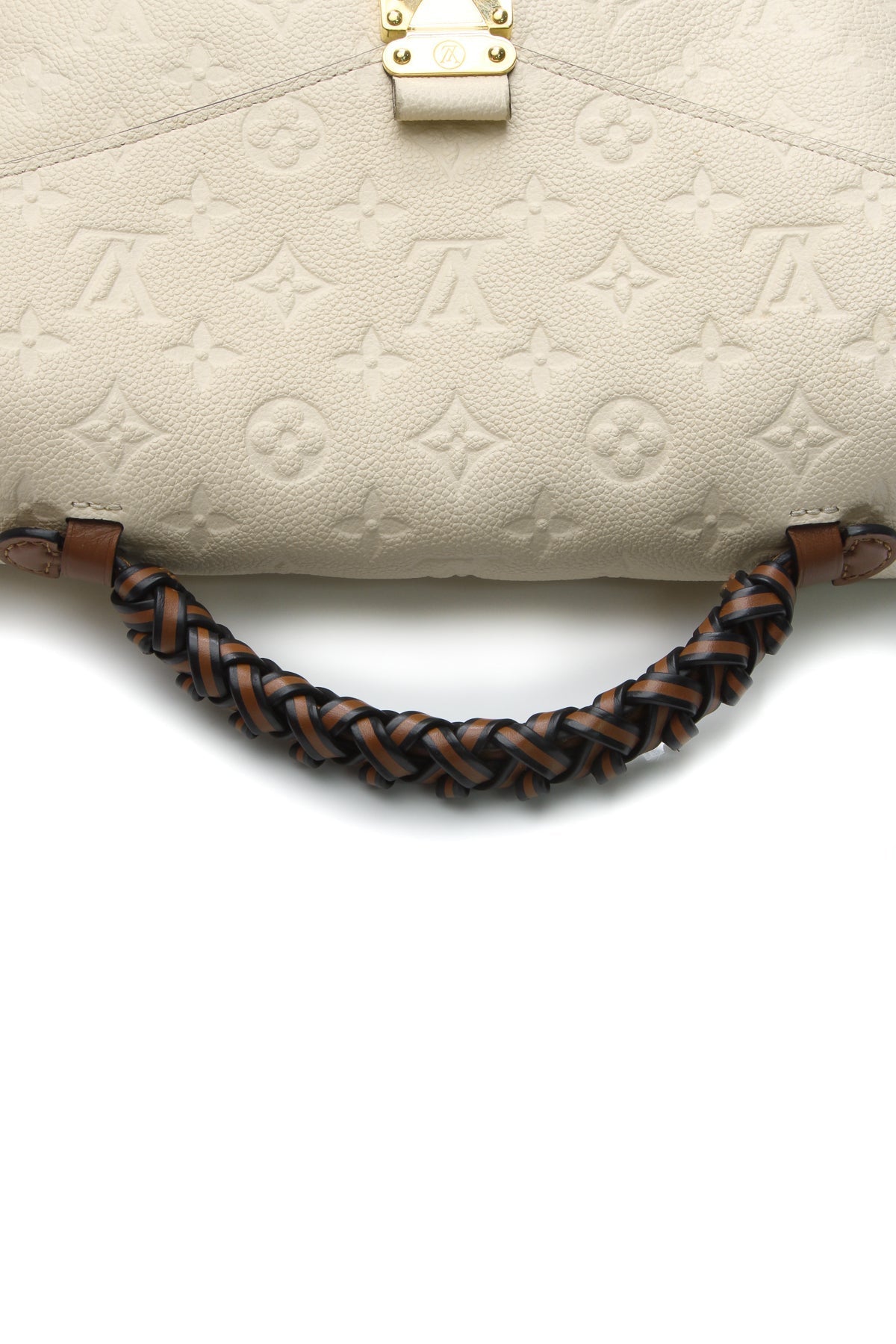 The bag shown with its braided top handle.