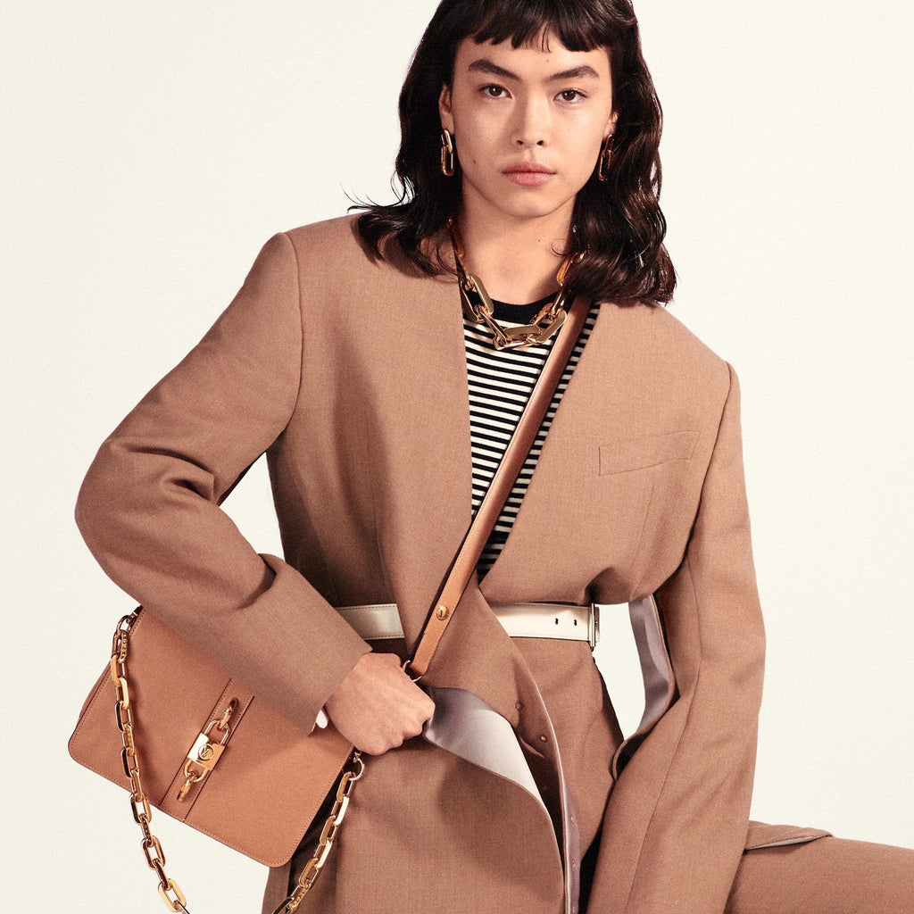 The bag being worn over the shoulder, highlighting its carry style