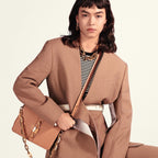The bag being worn over the shoulder, highlighting its carry style