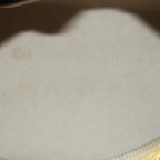 A profile view of the bag on a display stand