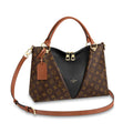 An angled profile view of the Louis Vuitton V Tote MM bag