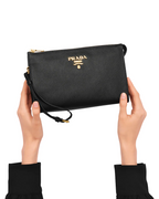 The zipper closure on the top of the clutch